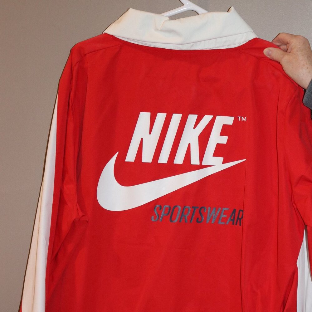 Women's white and red Nike XL pullover windbreaker.